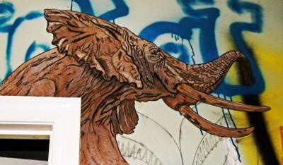 Street artist,TOVEN Wheatpaste at the Graffiti Warehouse in Baltimore, Maryland