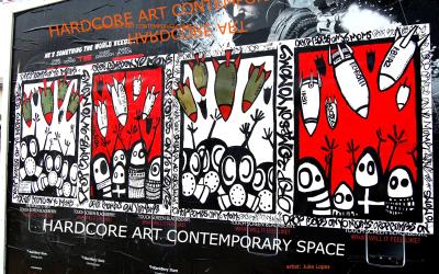 Wheatpaste posters depicting iraqi women in birkas as well as other figures with gas masks as bombs are being dropped from the sky
